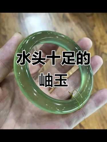 岫玉水头纹理辨识,天然絮纹棉杂与机器压制假纹破绽解析 岫玉水头纹理辨识,天然絮纹棉杂与机器压制假纹破绽解析
